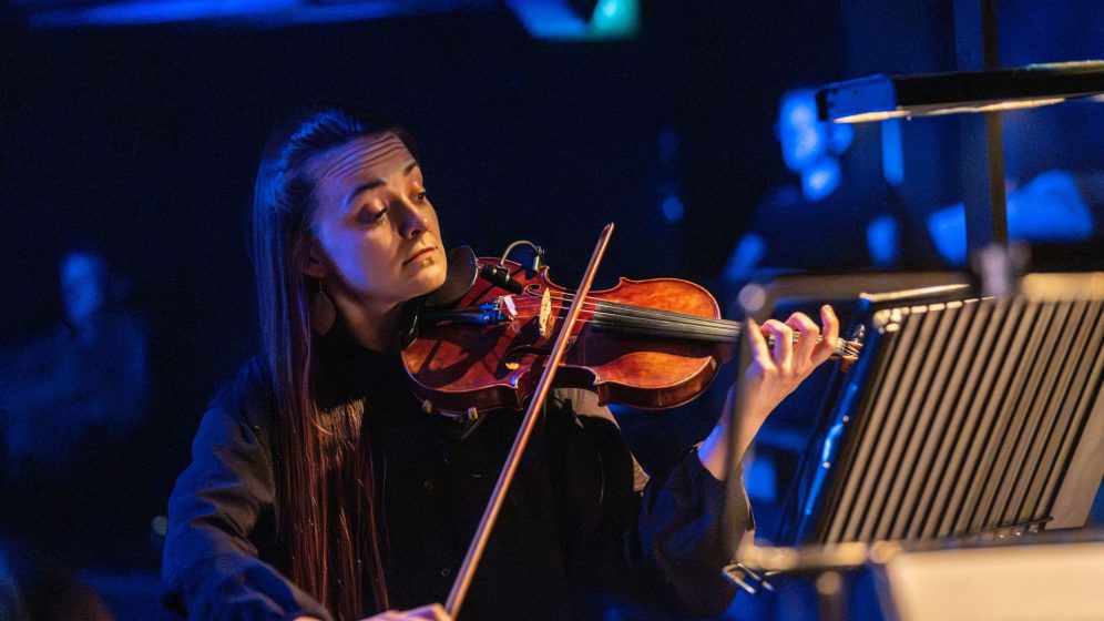 A woman plays the violin